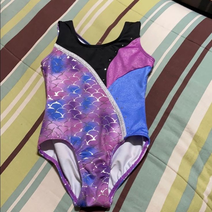 Toddler Girls One-Piece Swimsuit Or Leotard. Theme Is Mermaid Styling. Multi-Colored With Bling. 92% Polyester/ 8% Spandex & Machine Wash. New With Tags! Red Fitted Bodysuit For Playtime, Red Fitted Bodysuit For Casual Wear, Stretch Bodysuit For Playwear, Fitted Bodysuit For Playwear, Fitted Multicolor Bodysuit For Playwear, Playful Fitted Bodysuit For Playwear, Fitted Sleeveless Bodysuit For Playtime, Navy Bathing Suit, Unicorn Swimsuit