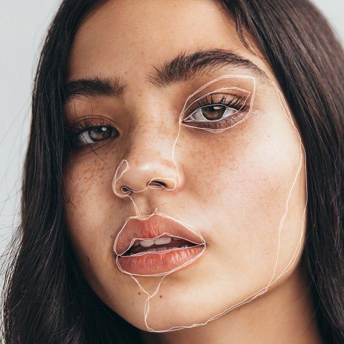 a woman with freckles on her face and nose