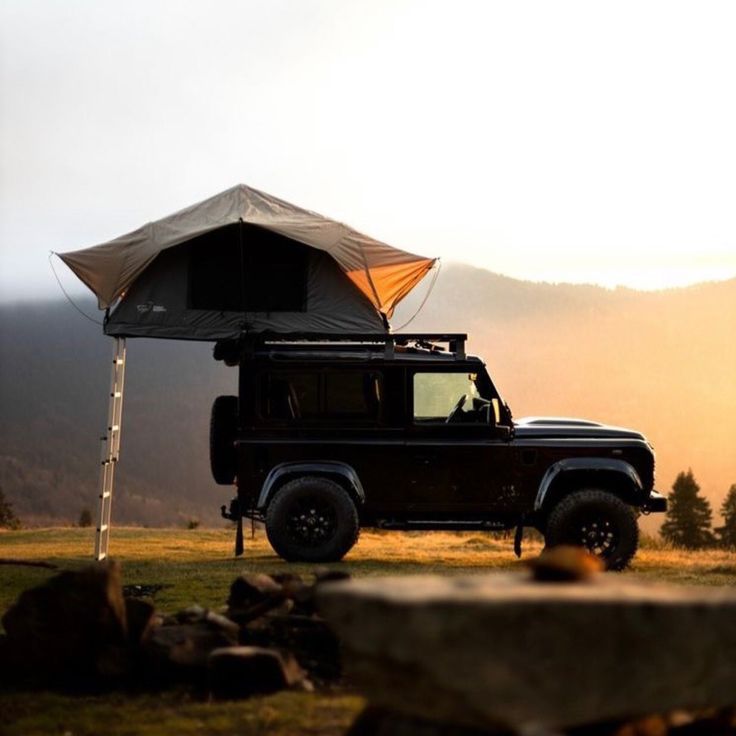 a jeep with an umbrella on the roof