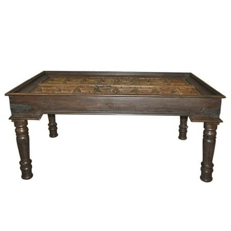 an old wooden table with carvings on the top and legs, against a white background