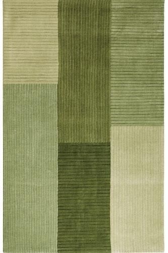 a green rug with squares and stripes on the bottom, in different shades of green