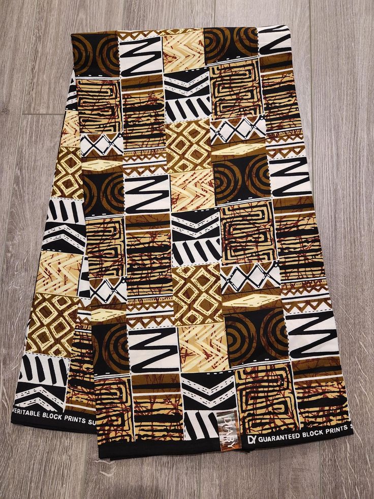 African Ankara Print Fabric. This is fabric is sold by the fold and each fold is approximately a yard.  This fabric is 100% cotton and has a width of 44in.  It can be used make different clothing, quilting and other sewing projects. Purchases of more than a yard, it will come in a continuous piece We ship via USPS First Class Mail, USPS Priority mail or UPS Traditional Brown Cotton Fabric, African Quilts, Clean And Press, Head Wrap Headband, Ankara Print, African Ankara, African Textiles, Fabric Headbands, Class Design