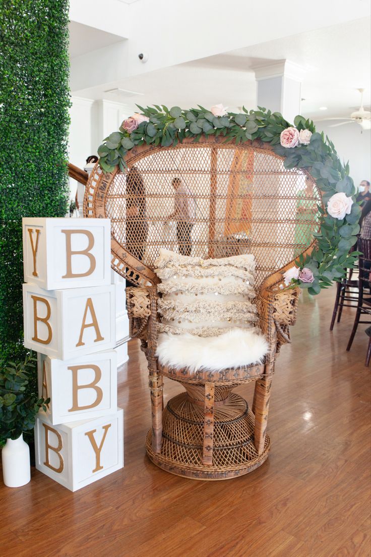 Baby shower, chair, bohemian Peacock Chair Balloon Garland, Baby Shower Chair Ideas, Mom To Be Chair, Decorate Chair For Mom To Be, Mom To Be Chair Decoration Ideas, Baby Shower Chair For Mom, Peacock Chair Baby Shower Ideas, Peacock Chair Maternity Shoot, Peacock Chair Decor