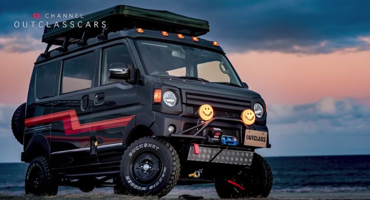 an suv parked on the beach at sunset