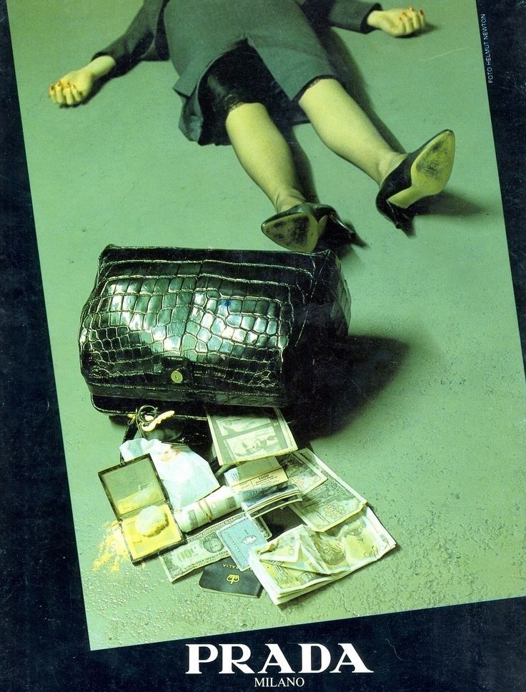 an advertisement for prada featuring a woman laying on the ground with her handbag