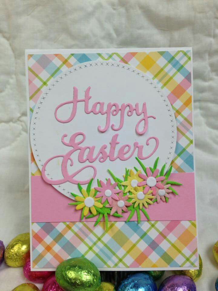 an easter card with flowers and eggs on the ground next to some colored candies