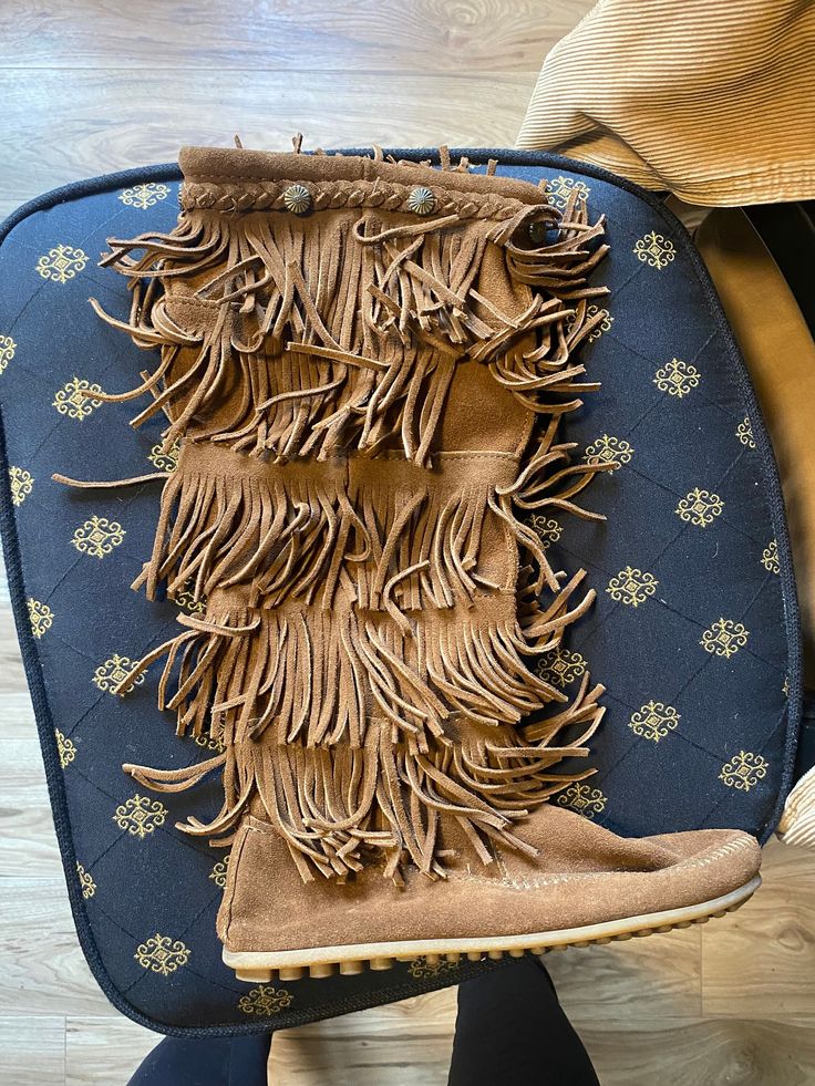 Chocolate brown, fringed knee high moccasin. Size 9 but fits more like 81/2 narrow. In perfect condition lightly worn. Casual Brown Boots With Tassels, Bohemian Brown Moccasins For Fall, Brown Bohemian Moccasins For Fall, Casual Brown Moccasins With Tassels, Brown Suede Moccasins With Fringe, Brown Suede Moccasins With Tassels, Casual Brown Boots With Fringe, Casual Brown Fringe Boots, Knee High Moccasins