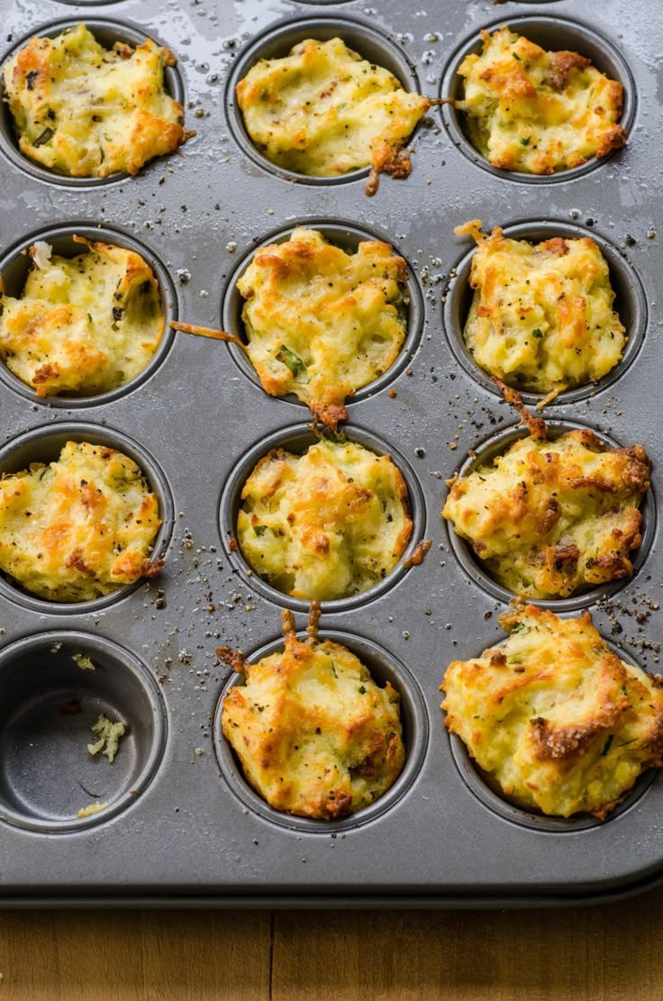 a muffin tin filled with several different types of food