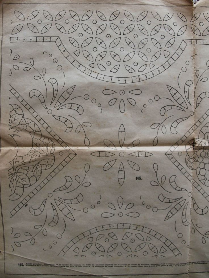 an old piece of paper that has been decorated with intricate designs and lines on it