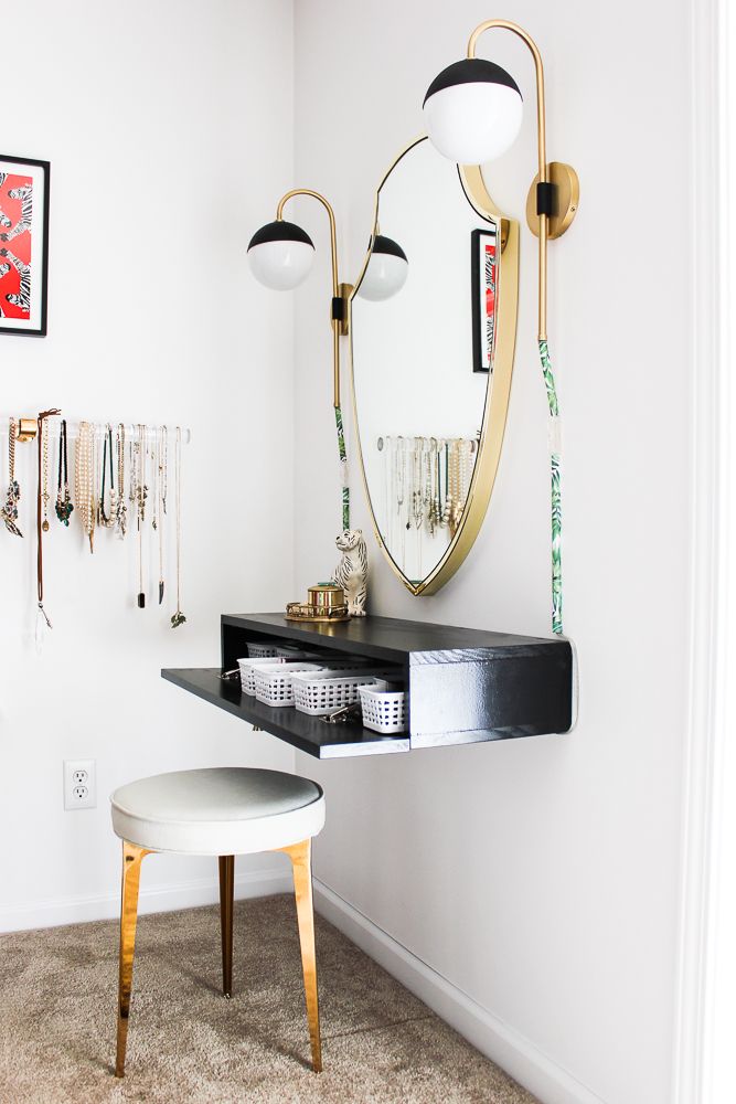 a mirror and stool in a room