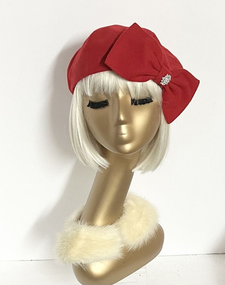 "Red wool beret hat with rhinestone on the bow, lined in rayon print, the top of the hat is made up of 6 section crown, wool bias 1\" fitted band and !' soft elastic band inside. One size fits most up to a 22\" head size  Made in the USA Dry Clean" Cute Cheap Red Hats, Winter Party Hats With Bow, Elegant Red Cloche Hat For Winter, Adjustable Red Winter Beret, Red Adjustable Winter Beret, Adjustable Mini Hats For Winter Evenings, Elegant Winter Flat Cap Mini Hat, Elegant Flat Cap, One Size Fits Most, Adjustable Felt Hat For Winter Evenings