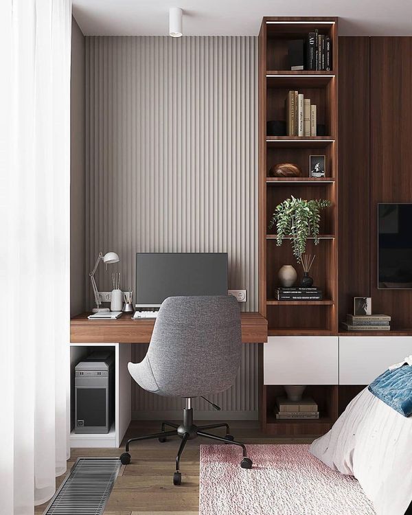 a bedroom with a bed, desk and bookcase in the corner next to a window