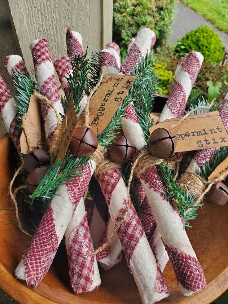 some candy canes are wrapped in burlock and tied with twine to them