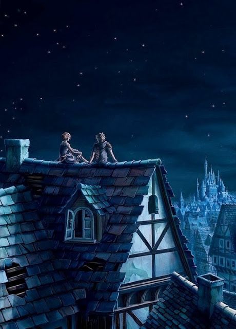 two people are sitting on the roof of a building at night, looking out over an old town