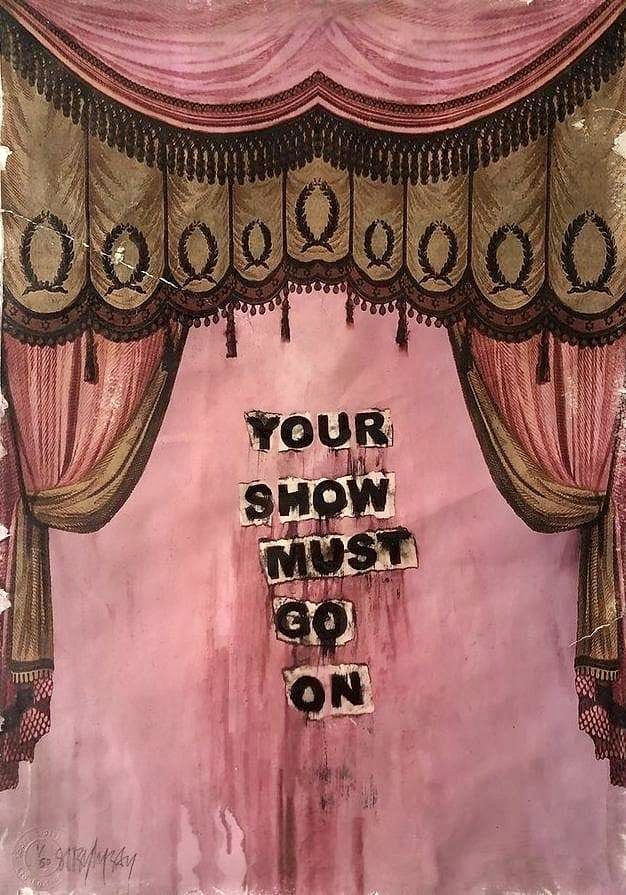 a pink stage curtain with the words your show must go on written in black ink