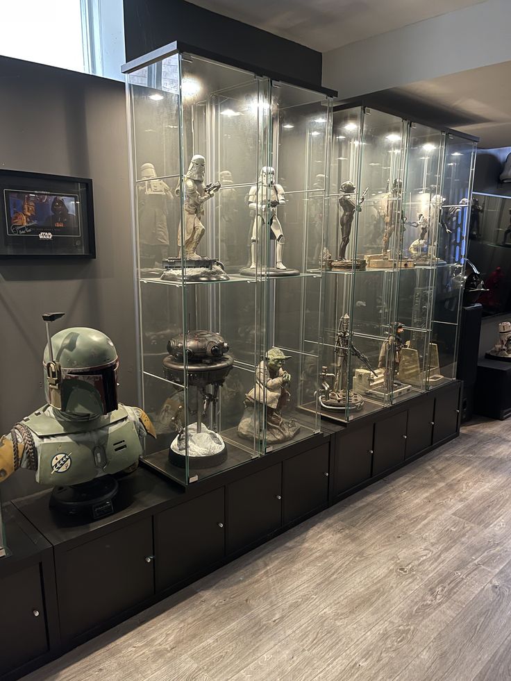 a display case filled with lots of star wars memorabilia