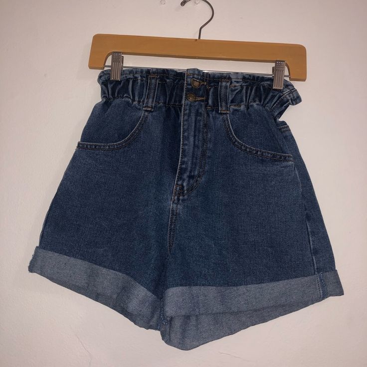 A Pair Of Denim Paper Bag Shorts Featuring An Elasticized Waist, Zip Fly, Front Slant Pockets, Back Patcpocketsh , A Cuffed Hoem. First 2 Pictures Are The Color Of The Denim, Last 3 Pictures Just Show How They Fit. They’re New! Never Worn. Casual High-waisted Jean Shorts With Belt Loops, High-waisted Jean Shorts With Pockets For A Day Out, Trendy High-waisted Dark Wash Jean Shorts, Trendy Dark Wash Jean Shorts, Dark Wash High-waisted Jean Shorts With Pockets, Casual High-waisted Shorts By Forever 21, Dark Wash Shorts With Pockets For Day Out, Forever 21 High Waist Casual Jean Shorts, Forever 21 High Waist Bottoms With Pockets