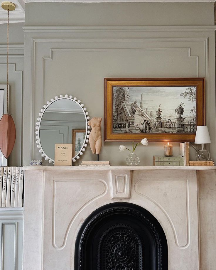 a fireplace with a mirror, vases and other items on it's mantle