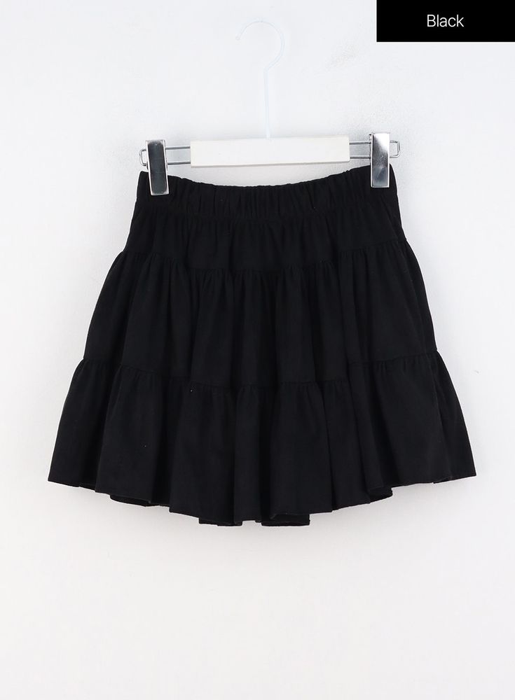 layered-ruffle-mini-skirt-oo325 / Black Solid Tiered Mini Dress, Chic Pleated Skirt For School, Casual Dresses With Ruffled Skirt, Casual Mini Dress With Ruffle Hem, Trendy Ruffle Hem Mini Skirt For Day Out, Cotton Mini Skirt With Ruffle Hem For Summer, Trendy Skort With Ruffle Hem In Mini Skirt Style, Casual Tiered Skirt Mini Dress For Summer, Spring Skirted Mini Dress With Ruffles