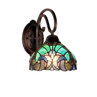 a wall light with a stained glass shade