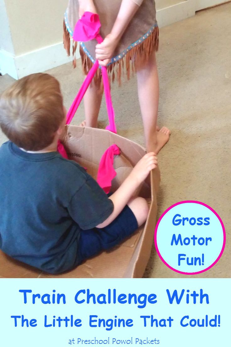 two children playing in a cardboard boat on the floor with text overlay reading gross motor fun train challenge with the little engine that could