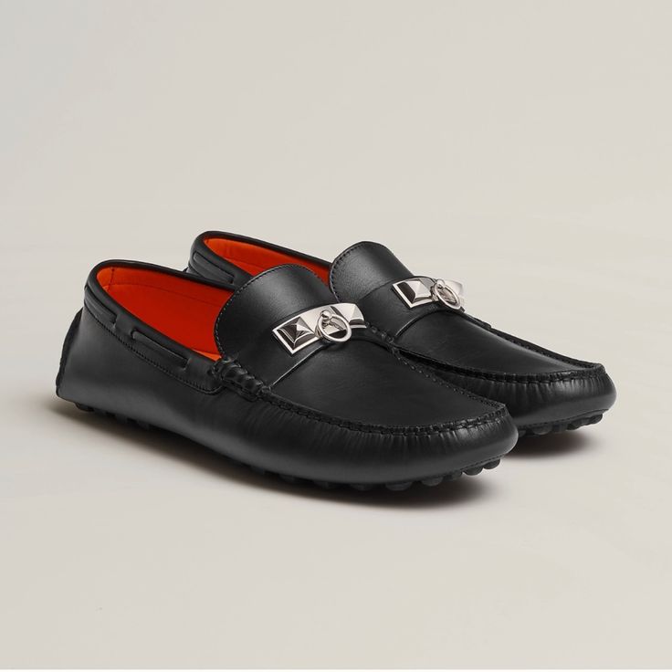 Hermes Driving Moccasin In Calfskin With Silver Or Black "Minidog Xl" Buckle, Hand-Sewn Upper, Rubber Studded Sole Driving Loafer In Calfskin With Hand-Stitched Apron And Palladium-Plated Collier De Chien Hardware. Step Out In A Versatile Driving Loafer, Suitable For Any Occasion. We Recommend That You Try Your Shoes On Non-Abrasive Surfaces. We Will Not Be Able To Accept Your Return If The Sole Is Damaged Or Marked. Made In Italy Luxury Evening Loafers With Rubber Sole, Luxury Slip-on Formal Moccasins, Luxury Calf Leather Moccasins For Driving, Luxury Calf Leather Driving Moccasins, Luxury Formal Moccasins With Rubber Sole, Luxury Driving Moccasins, Luxury Round Toe Moccasins For Business, Luxury Leather Driving Moccasins, Luxury Moccasins For Galas With Leather Lining