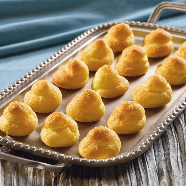 small pastries are on a tray ready to be baked in the oven for consumption