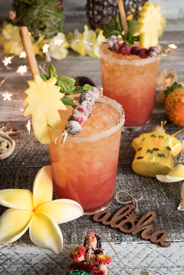 two cocktails sitting next to each other on a table