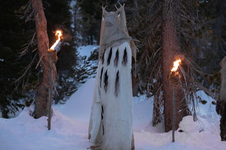 an image of a ghost in the snow with torches coming out of its back end