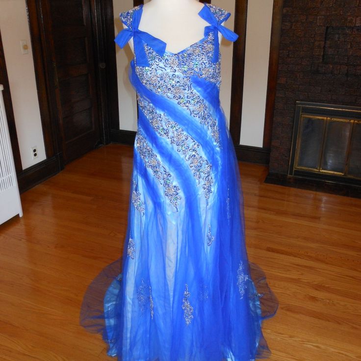 This Is An Elegant Beaded Pageant Evening Dress. It Has An Elegant Pageant Shape And A Chapel Train. The Entire Dress Is Embellished With Exquisite Embroidery And Sparkling Beads/Sequences. It Comes With A Matching Shawl. This Dress Is Brand New In Great Condition. Size: 10 Bust: 38" Waist: 32" Hips: 42" Color: Royal Blue Blue Rhinestone Pageant Dress, Blue Embellished Dress For Pageant, Blue Formal Dress With Rhinestones, Blue Evening Dress With Rhinestones For Prom, Blue Rhinestone Evening Dress For Formal Events, Blue Rhinestone Evening Dress For Formal Occasions, Formal Blue Rhinestone Evening Dress, Blue Rhinestone Evening Dress For Prom, Blue Rhinestone Formal Evening Dress