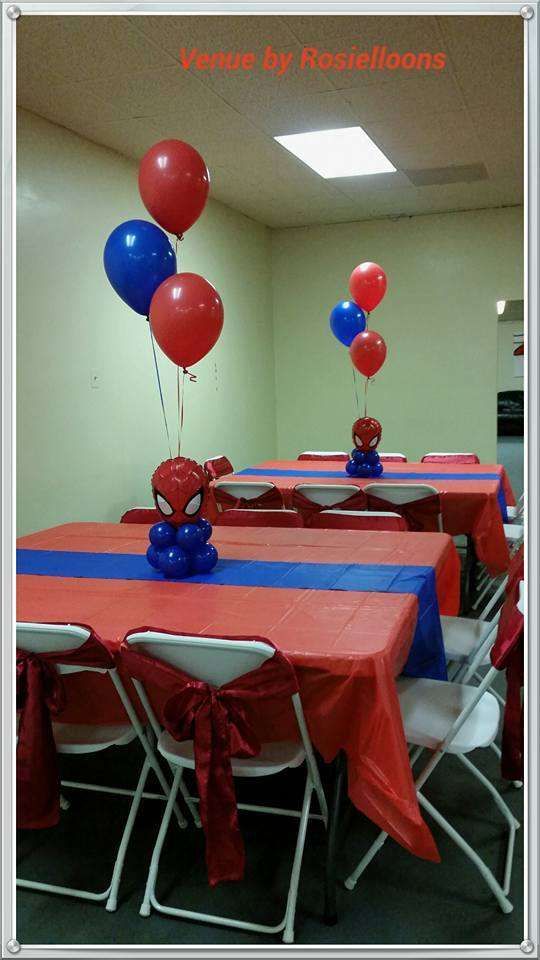 red, white and blue balloons are in the shape of spiderman's head