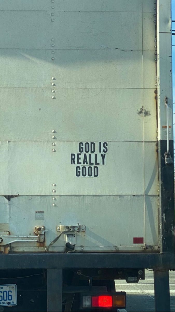 the back end of a truck with graffiti on it's side and words that read, god is really good