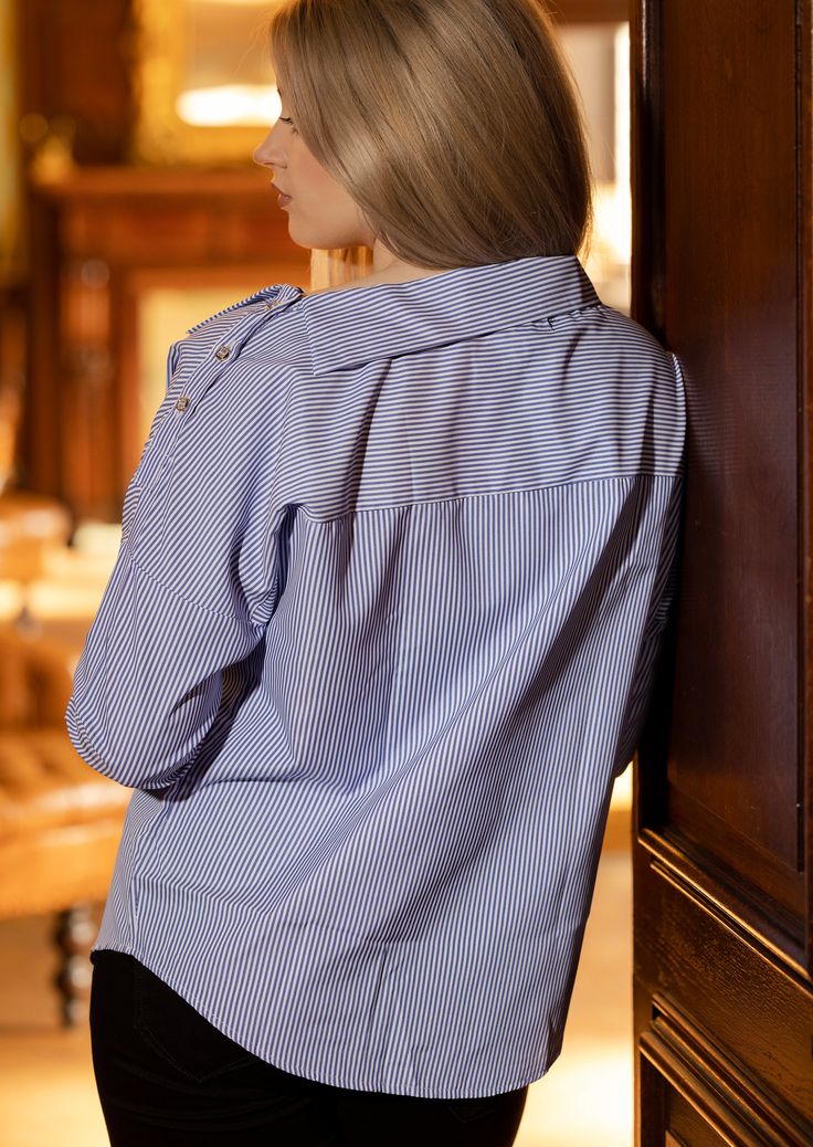 This long sleeve shirt is detailed with stripe pattern and fashionable neckline. The design is elevated by buttoned cuff. This easy-to-wear stripe shirt will quickly become a wardrobe hero. Just add statement heels for a glam queen look. Whatever jeans and a nice top combo you choose, don’t forget to add layers of jewellery and sky-high stilettos. Long sleeves Buttoned cuffs Blue Workwear Top With Striped Collar, Blue Long Sleeve Blouse With Vertical Stripes, Striped Button Shirt For Work, Business Casual Vertical Stripes Button-up Tops, Vertical Stripes Button-up Top For Work, Striped Long Sleeve Shirt For Office, Casual Pinstripe Tops For Business Casual, Pinstripe Long-sleeved Shirt With Button Closure, Pinstripe Long Sleeve Shirt With Placket