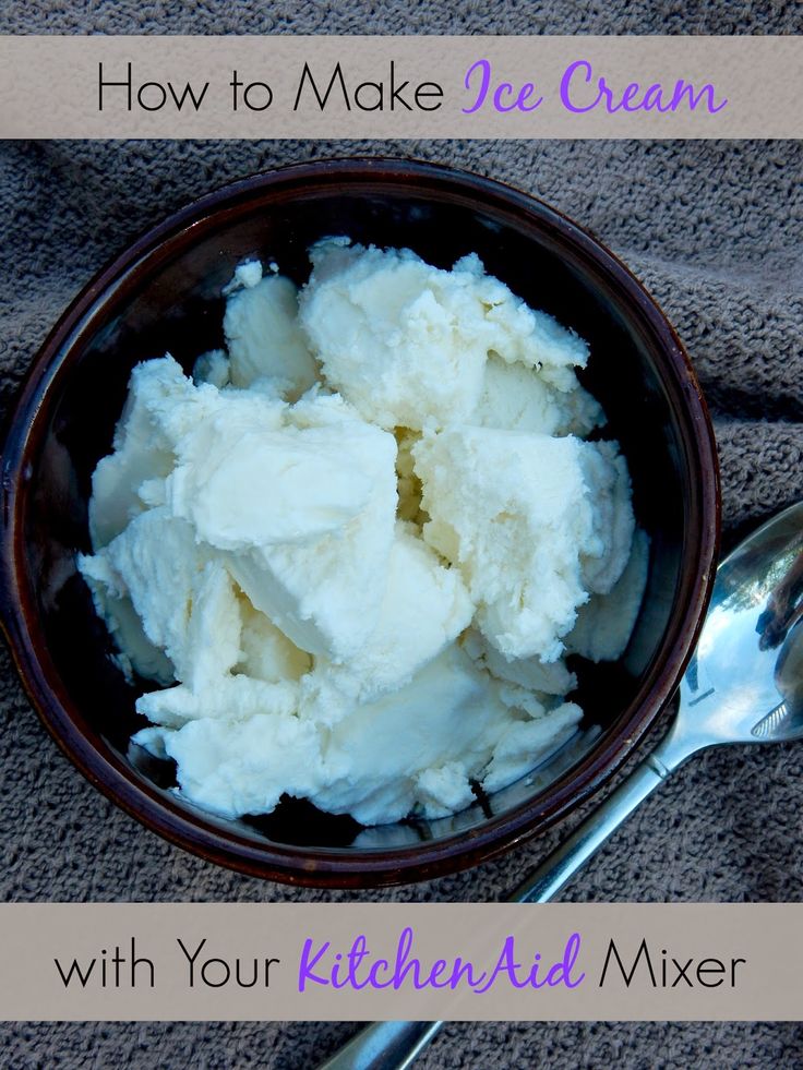 a bowl filled with ice cream next to a spoon