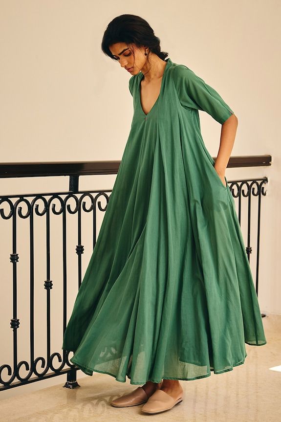 Sap green maxi dress crafted from soft mul cotton. - Aza Fashions Cotton Maxi Dress For Daywear, Flowy Cotton V-neck Midi Dress, Relaxed Fit Maxi Dress For Daywear, Chic Relaxed Fit Maxi Dress, Green Flowy Long Dress, Flowy Green Long Dress, Casual Cotton Floor-length Maxi Dress, Green Cotton V-neck Dress, Flowy Green Floor-length Maxi Dress