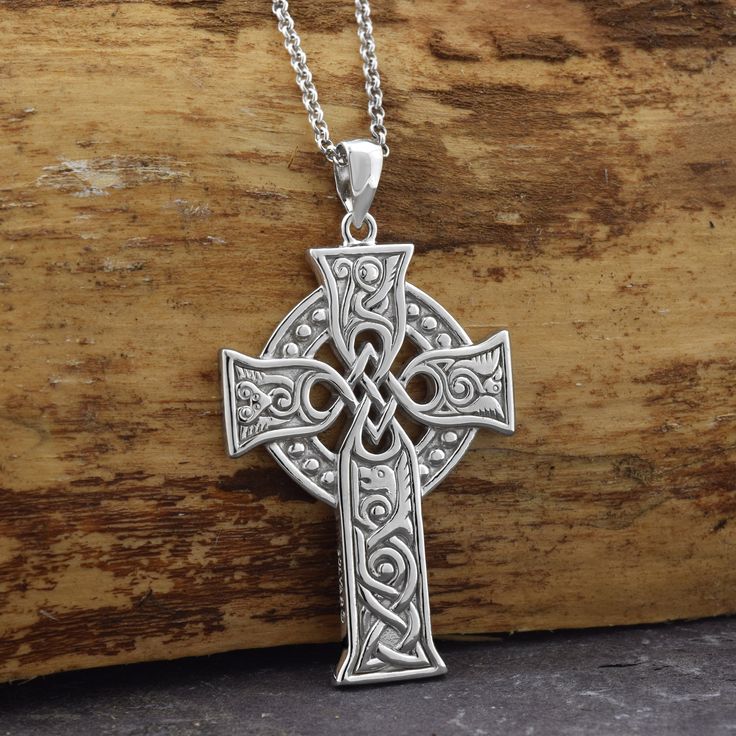 "**ANNOUNCEMENT** WE OFFER HALF PRICE FEDEX SHIPPING AT ONLY $20 SO YOU GET YOUR ORDER ON TIME FOR CHRISTMAS! (SELECT AT CHECKOUT)This has to be one of my favorite religious Celtic pendants. There is so much biblical symbology etched beautifully in this cross. - Sterling silver cross - Handmade in Dublin  - Hallmarked at the Assay office in Dublin castle - Chain - 16\", 18\", 20\", 22\", 24\" - A beautiful gift box is included - Free shipping - 30 day money back guarantee This sterling silver Ce Symbolic Cross Pendant Necklace, Silver Symbolic Cross Necklace, Symbolic Antique Silver Cross Jewelry, Silver Etched Cross Necklace, Antique Silver Cross Symbolic Jewelry, Antique Silver Symbolic Cross Jewelry, Silver Cross Pendant Necklace, Silver Engraved Cross Pendant Necklace, Celtic Cross Necklace