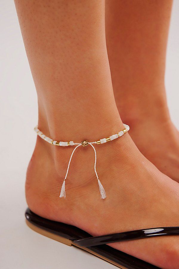 Designed to add the perfect little something extra to absolutely every look, this effortless anklet is featured in a forever classic beaded design with varying shapes and finishes for a super cool, collected style. | Sun Moon Rain Anklet by Free People in White Festival Anklets With Adjustable Length, Festival Adjustable Anklets, Trendy Tiny Beads Anklets For Summer, Trendy Summer Anklet With Tiny Beads, Adjustable White Anklets For Spring, Elegant Beaded Summer Anklets, Spring Anklets With Colorful Beads, Elegant Summer Bracelets With Tiny Beads, Adjustable White Ankle Wrap Bracelet