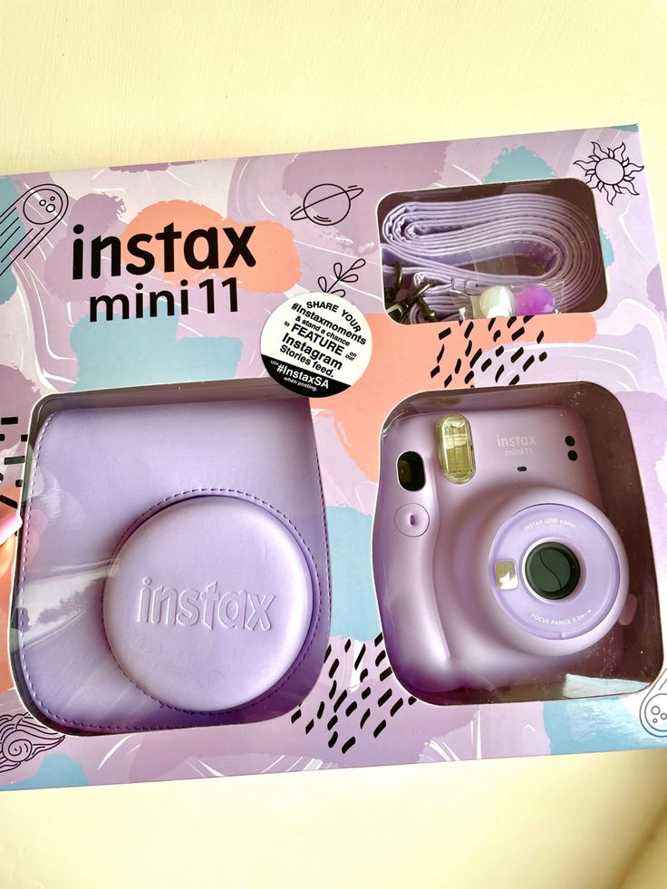 an instax mini camera in its box