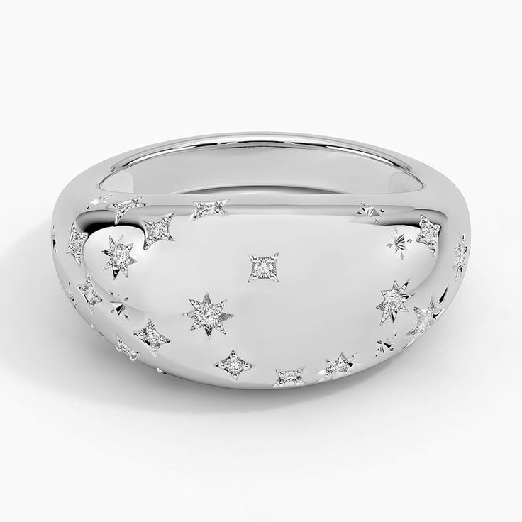 a white gold ring with stars on it