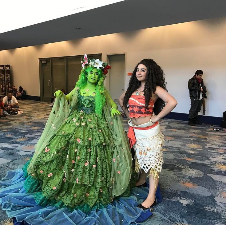 two women in costumes standing next to each other