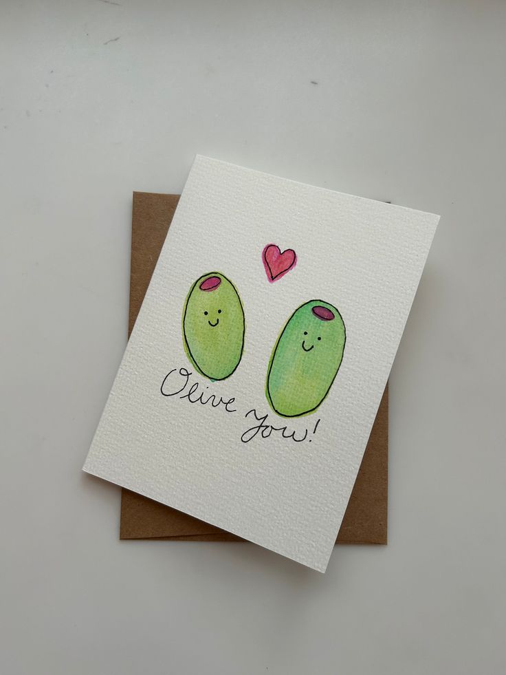 a card with two green fruits on it that says, i love you