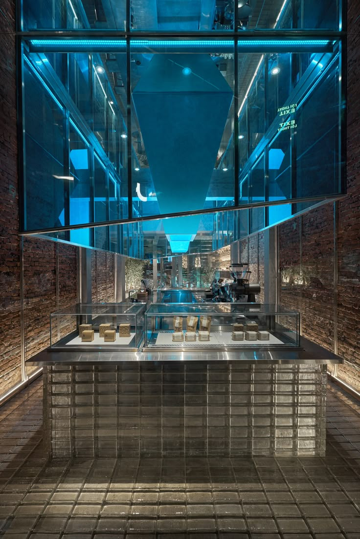 the inside of a building with glass walls