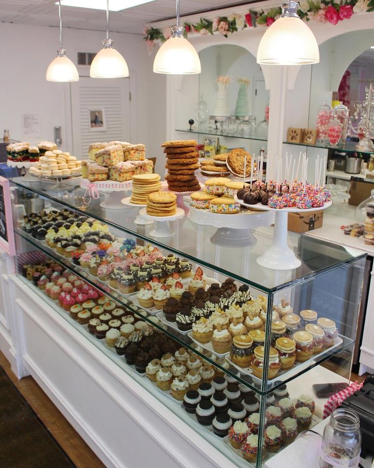 a bakery filled with lots of cakes and cupcakes