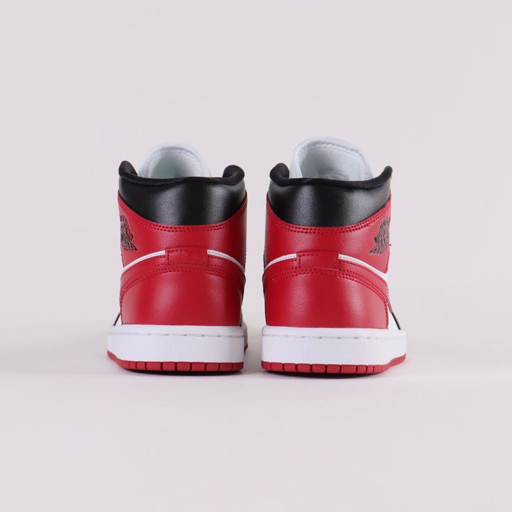 Debuted in 1985, the Air Jordan 1 Mid Red Black offers a rendition to the iconic classic. Released August 17th, 2022.* Jumpman logo on tongue* Leather and synthetic upper offers durability * Black wings logo on the side * Black, white and red colour blocking Size and Fit* Fits true to size Air Jordan 1 Mid Red, Jordan 1 Mid Red, Nike Air Jordan 1 Mid, Jumpman Logo, Wings Logo, Colour Blocking, Black Wings, Nike Air Jordan 1, Red Colour