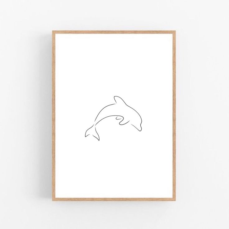 a minimal line drawing of a dolphin's head in black and white, framed on a wall