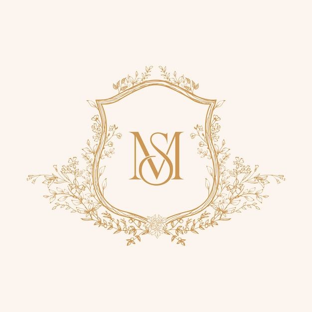 an elegant monogram with the letter m in gold on a cream background is shown