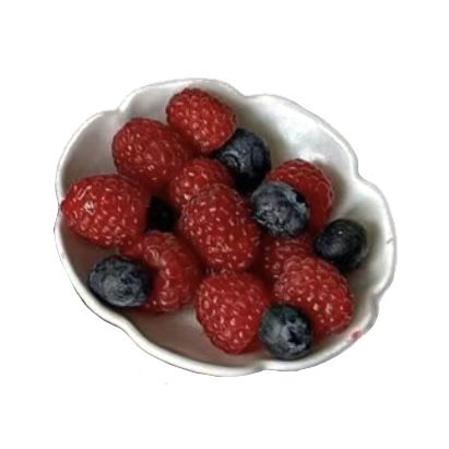 a bowl filled with raspberries and blueberries on top of a white table