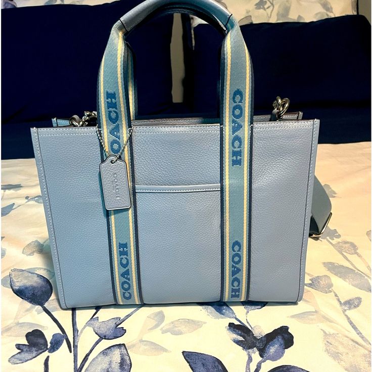 Brand New Authentic Coach Bag. Was Purchased Saturday June 8th, 2024. Was Never Used And The Size Is Not For Me. Daily Use Coach Bag In Light Blue, Blue Coach Bag With Top Carry Handle, Coach Blue Tote Bag, Coach Dempsey Tote 22 Blue, Blue Coach Bag With Double Handle, Tote Coach, Coach Tote Bag, Coach Tote Bags, Coach Tote