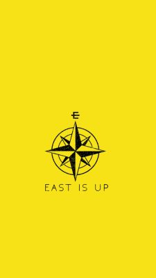 the logo for east is up, which features an image of a compass on it