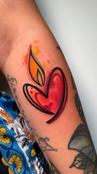 a woman's arm with a tattoo on it and a heart in the middle